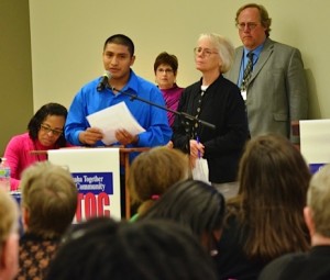 Community member speaking on an issue at an Omaha Together One Community event.