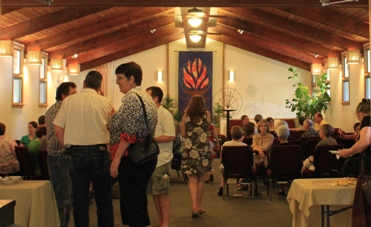 Congregants enjoy coffee and conversation with newcomers during Sunday morning fellowship hour.