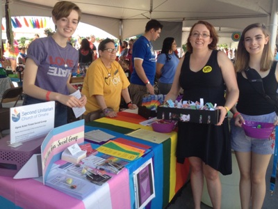 Second U members standing at our Pride festival booth