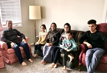Family after moving into their apartment.