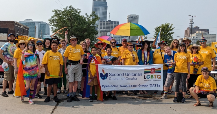 Forty 2U members gathered to march in Pride Parade. Many wearing Side With Love t-shirts.