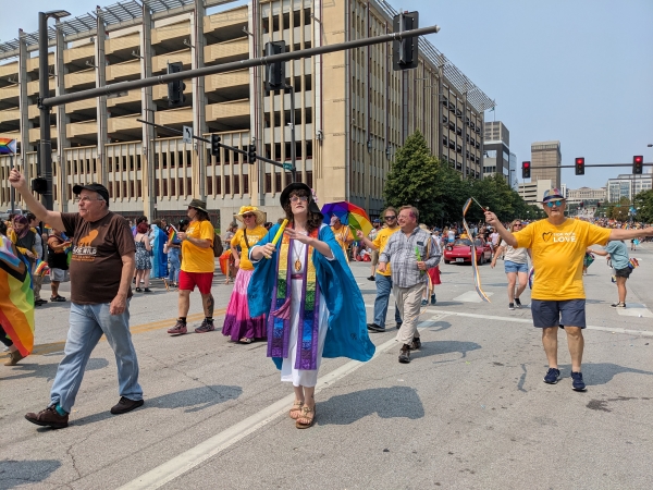 Rev. Juniper Meadows and Second Unitarian members walking in the Pride parade.